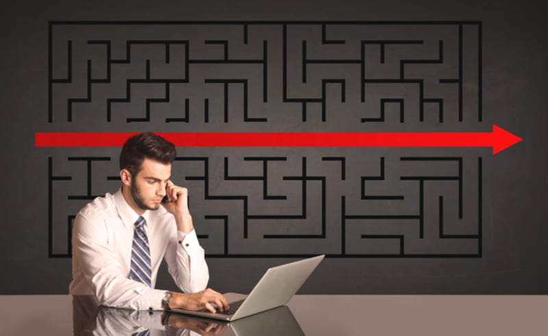 Successful businessman with a solved puzzle in background